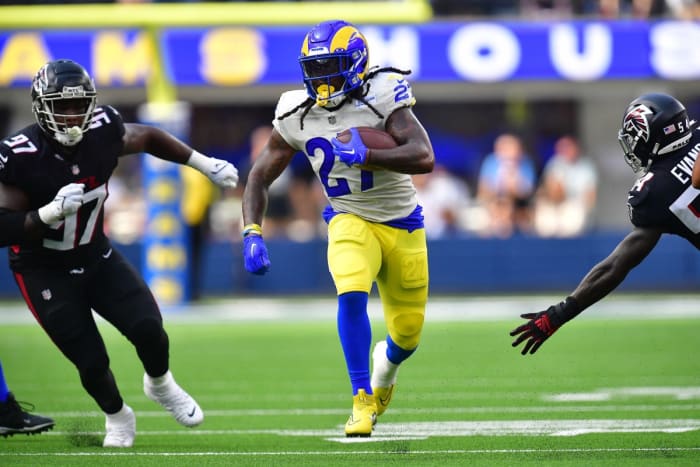 Los Angeles Rams running back Darrell Henderson Jr. (27) runs the ball against the Atlanta Falcons. Mandatory Credit: Gary A. Vasquez-USA TODAY Sports